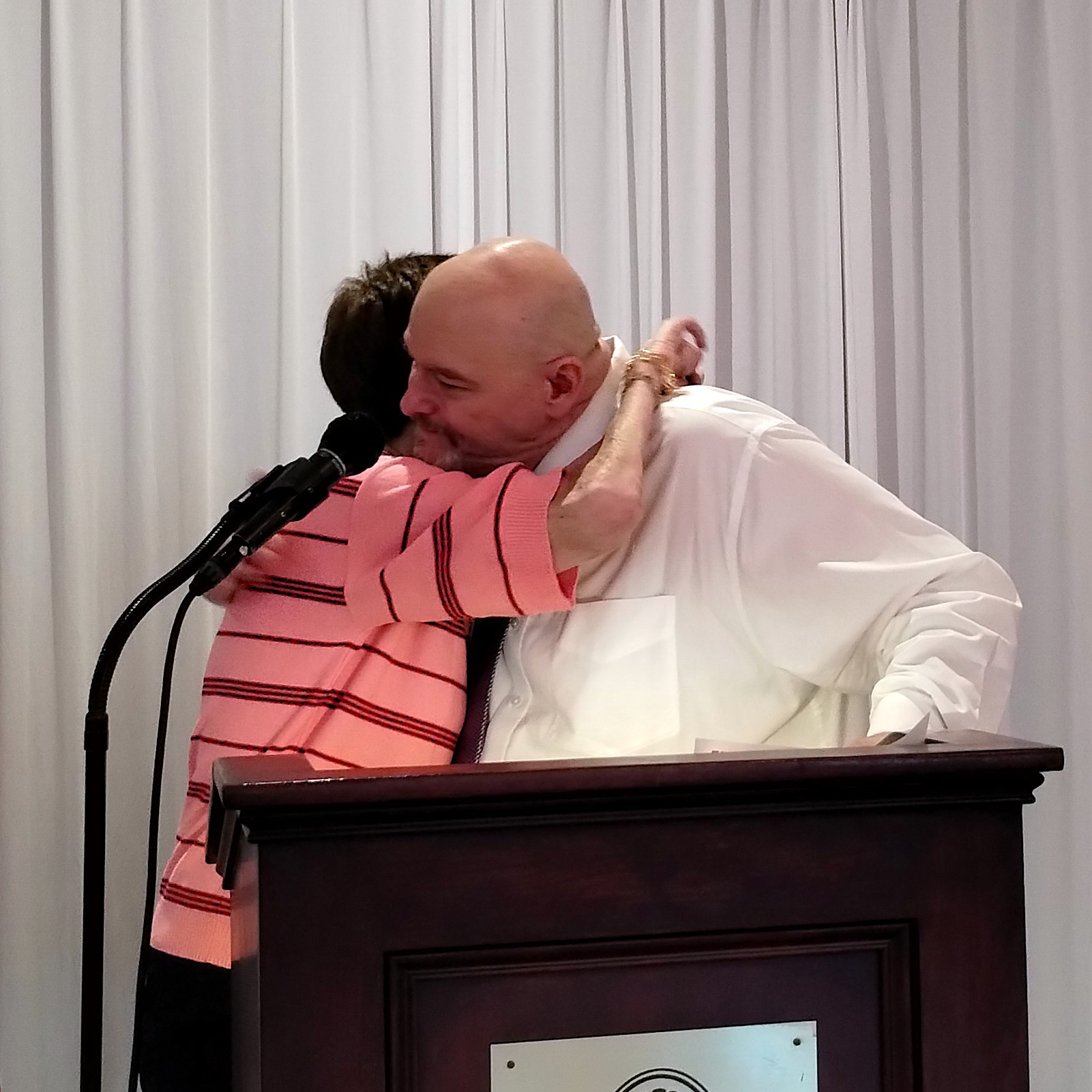 Bill and Chief Steward Jean Morningstar share a moment during the presentation of the plaque honoring his years of service to UHP.