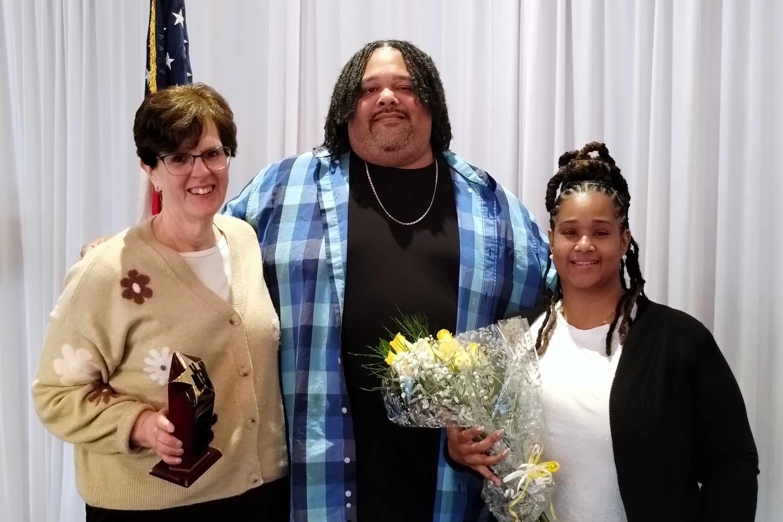 Laura Didden accepts the We Are UHP Award from 1st VP Shawn Brown and VP Membership Activities Shaneé Reid.