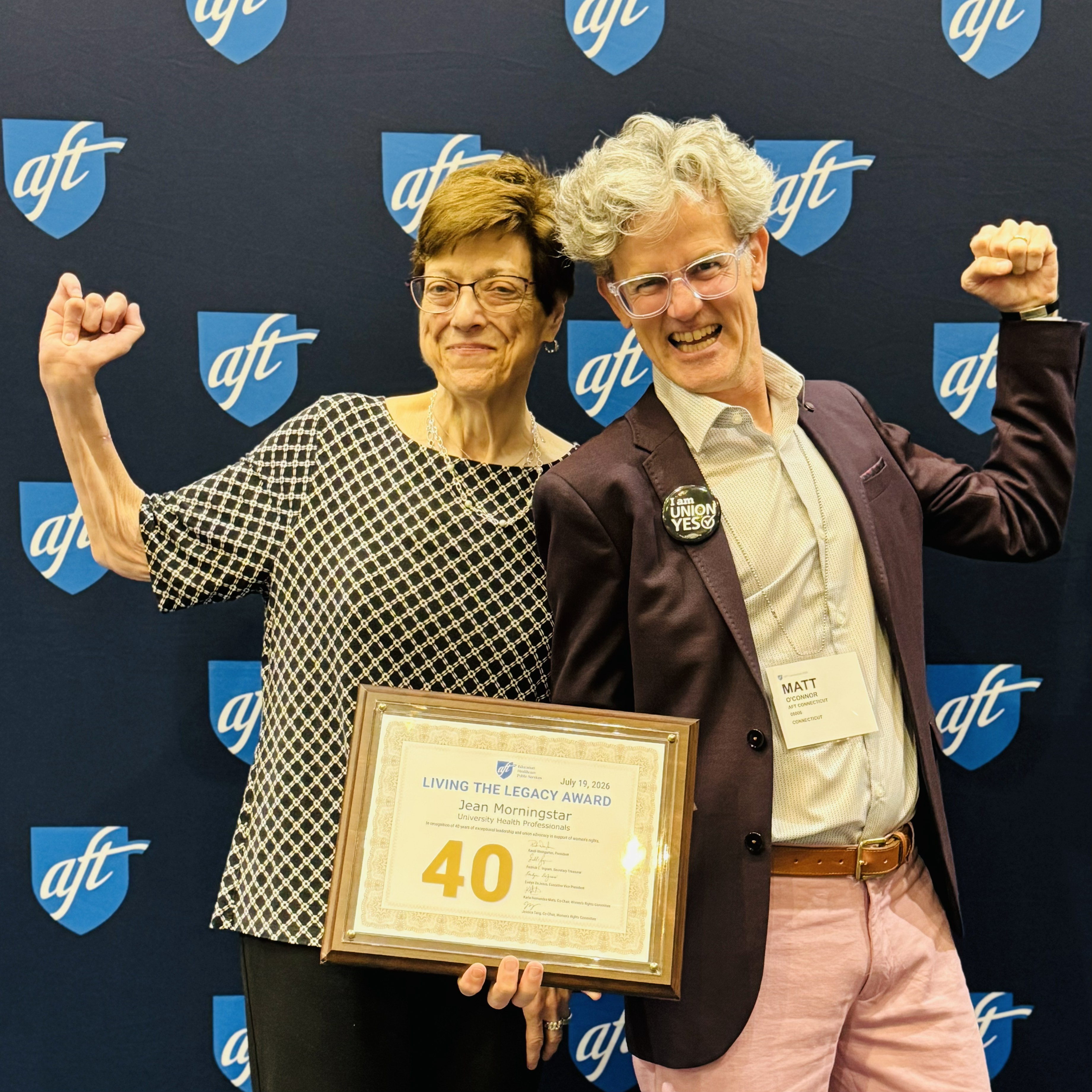Jean celebrates her award with AFT CT’s Matt O’Connor
