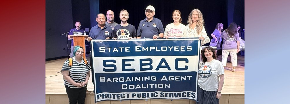 group portrait with SEBAC banner