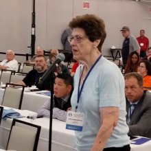 Jean speaking from convention floor