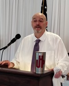 Bill addressing the body in his last business convention as UHP president
